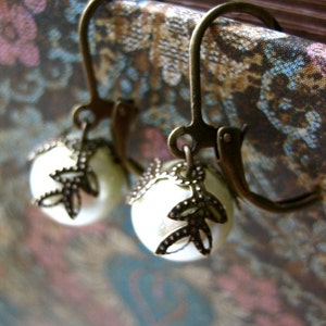 Pretty pearl earrings. image 4