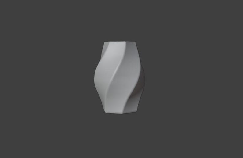 May include: A white, vase-shaped object with a twisted design. The vase has a square base and a wider top, with a smooth, matte finish. The background is a solid gray.