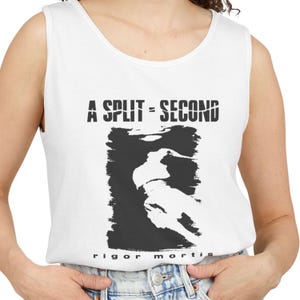 May include: A white sleeveless tank top featuring a black graphic print. The text A SPLIT-SECOND is printed in a distressed font above a black rectangular block containing a white silhouette of a figure. The text rigor mortis is printed below.