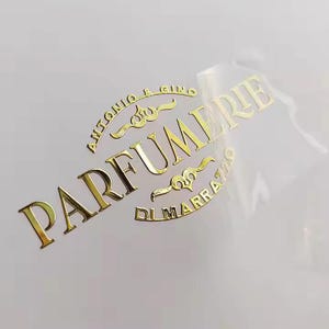 Custom Metallic Logo Stickers • UV Transfer, Hot Foil, or Metal Finish Labels for Packaging & Branding