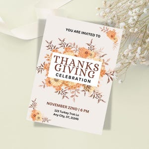 May include: A Thanksgiving invitation with a floral design featuring orange and yellow flowers. The text reads "You are invited to Thanksgiving Celebration, November 22nd | 6 PM, 123 Turkey Trot Ln, Any City, ST, 21245."