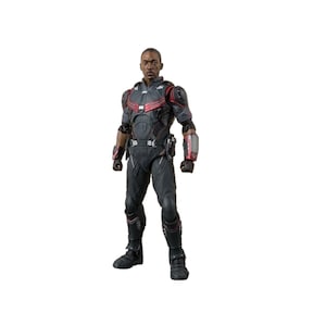 May include: A black and red action figure of a superhero wearing a black suit with red accents and a black helmet. The figure has a detailed design and is posed in a standing position.
