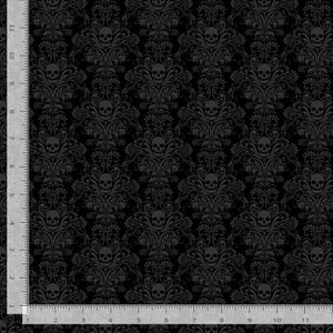 May include: Black fabric with a repeating pattern of skulls and ornate floral damask designs. The skulls are a darker shade of gray, creating a subtle contrast against the black background. The fabric is suitable for gothic or Halloween-themed projects.