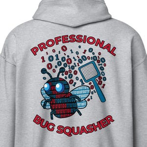 May include: A grey hoodie featuring a red and blue bug design with the text "PROFESSIONAL BUG SQUASHER" in red. The bug is surrounded by binary code.