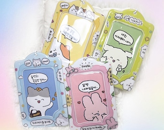 May include: Four colorful photo card holders with cute cartoon animal illustrations and Korean text. Each holder has a clear plastic window for inserting a photo. The text on the holders reads: "Will you marry me?", "You are my everything", "I love you", and "You are mine now".
