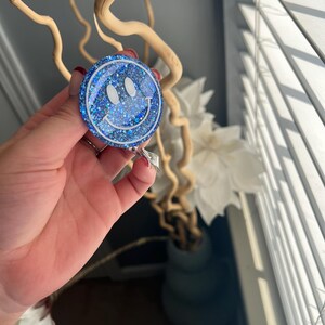 Smiley face badge reel| bright blue color| badge reel| retractable badge