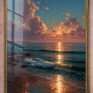 May include: A framed landscape painting depicts a sunset over the ocean. The sky is a mix of blue and orange hues, with fluffy clouds. The sun's reflection shimmers on the water's surface, and the waves gently roll onto the shore.