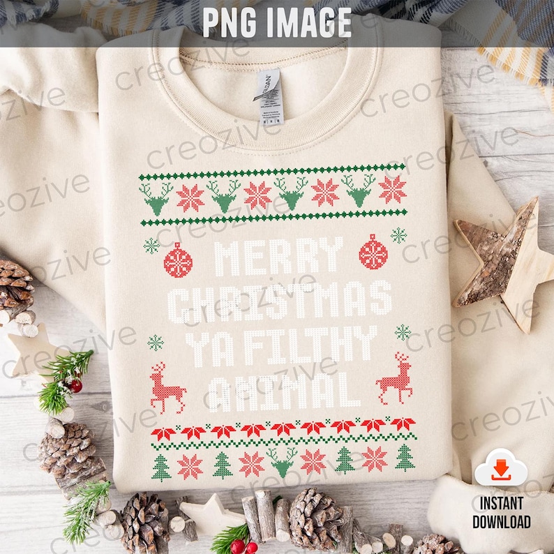 May include: A beige sweatshirt with a Christmas-themed design featuring a red and green pattern with reindeer, snowflakes, and Christmas trees. The text "Merry Christmas Ya Filthy Animal" is printed in white.