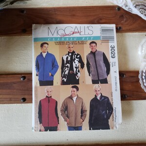 May include: A McCall's sewing pattern for a unisex jacket and vest. The pattern is for sizes small, medium, and large. The pattern shows a blue jacket, a black and white patterned jacket, a gray vest, a red vest, a brown jacket, and a black jacket.