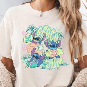 a woman wearing a t - shirt with a cartoon character on it