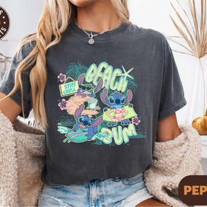 a woman wearing a t - shirt with a cartoon character on it