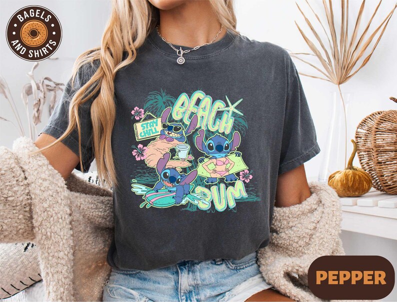 a woman wearing a t - shirt with a cartoon character on it