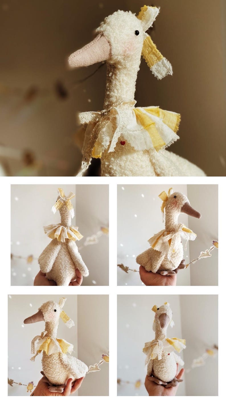 May include: A plush, cream-colored goose doll with a long neck and a light brown beak. It has a yellow and white ruffled collar and a matching bow on its head. The doll is handmade and has a soft, textured appearance.