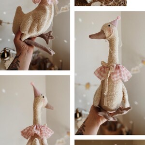 May include: A plush goose toy with a cream-colored body, a long neck, and a brown beak. It wears a pink and white checkered ruffle collar and a matching party hat. The toy is soft and fluffy, with a whimsical design.