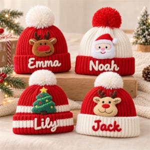 May include: Four knit winter hats with pom-poms, each featuring a holiday character and a name. One red hat says Emma with a reindeer, one white hat says Noah with Santa, one red and white striped hat says Lily with a tree, and one red hat says Jack with a reindeer.
