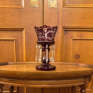 An antique Egermann ruby red stained glass petite mantle lustre.