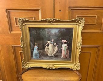 An ornate antique brightly coloured print / photograph in an ornate gilded wood frame
