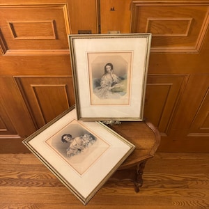 Pair of antique late 19th century Victorian engravings in classic gilded wood frame.