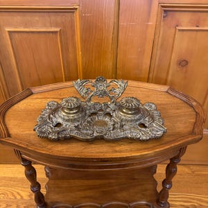 An ornate Antique Art Nouveau style double brass French inkwell