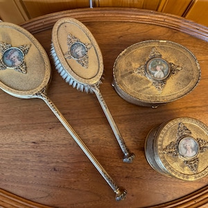 Rare Vintage Apollo gilt 4 piece ornate vanity set with Victorian portraits.