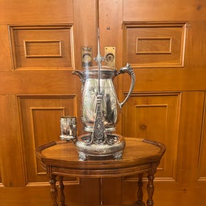 Antique 19th century circa 1880 Victorian Aesthtic movement silver plated iced water pitcher on stand with goblet.