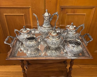 Outstanding 19th century Aesthetic Movement repousse floral silver plated teaset.