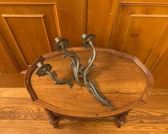 An antique late 19th century / early 20th century Rococo Louis XV style bronze 3 arm candle sconce.