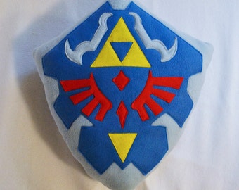 Almofada / pelúcia do escudo Hyrulian Legend of Zelda