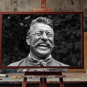 May include: A black and white painting of a man with a mustache and glasses, laughing with his mouth open. The painting is framed in a dark wood frame and is on an easel.