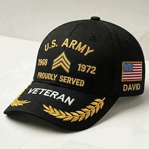 May include: A black baseball cap featuring gold embroidered text that reads U.S. ARMY, 1968, 1972, PROUDLY SERVED, and VETERAN. The cap includes a gold chevron insignia, a small American flag patch on the side, and the name DAVID embroidered in gold.