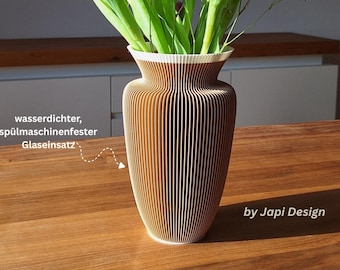 May include: A brown and white ribbed vase with a flared rim, containing purple tulips and white baby's breath flowers. The vase features the text "wasserdichter, spülmaschinenfester Glaseinsatz", "by Japi Design", "AMSTERDAM", and "H22cm".