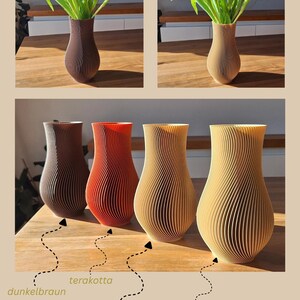 May include: A collection of four vases with a vertical ribbed, spiraling texture. The vases are available in dark brown, terracotta, light brown, and beige. The text "by Japi Design" is visible in the bottom right corner of the image.