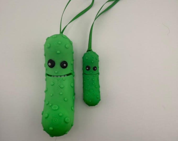 Articulating Christmas Pickle holiday ornament with moving mouth and grill.  3D printed with multiple colors