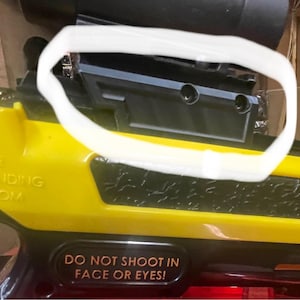 May include: A yellow and black Bug-A-Salt salt gun with a black scope. The gun has the text "DO NOT SHOOT IN FACE OR EYES!" and "BUGASALT.COM".