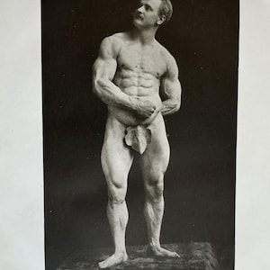 May include: A vintage black and white photograph of a muscular man, standing and looking upwards. The man has a mustache and is partially covered by a leaf. The text "THE LATE EUGENE SANDOW" is at the bottom.