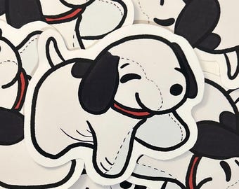 May include: A stack of white and black cartoon dog stickers with red collars. The dogs are smiling and have their tongues sticking out.