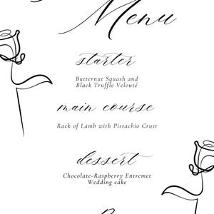May include: A wedding menu with a black and white floral design. The menu includes a starter of butternut squash and black truffle velouté, a main course of rack of lamb with pistachio crust, and a dessert of chocolate-raspberry entremet and wedding cake.