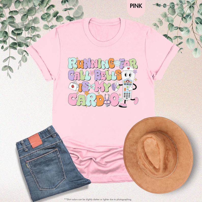 May include: Pink t-shirt with a graphic of a cartoon remote control with the text "Running for call bells is my cardio".