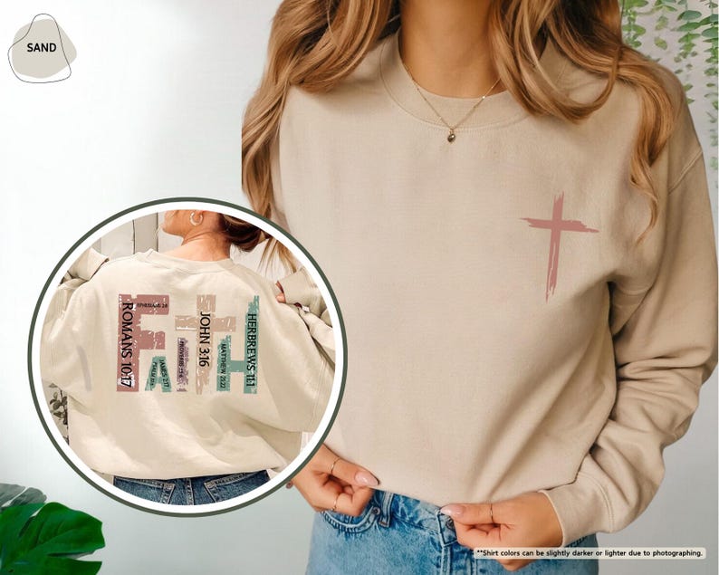 May include: A beige sweatshirt with a cross design on the front and the word "FAITH" spelled out vertically on the back with bible verses. The verses are: Hebrews 11:1, John 3:16, Matthew 17:20, Romans 10:17, Ephesians 2:8, and Mark 9:23.