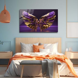 May include: A pair of gold and purple wings with a 3D effect, set against a purple background. The wings are spread wide and appear to be made of metal.