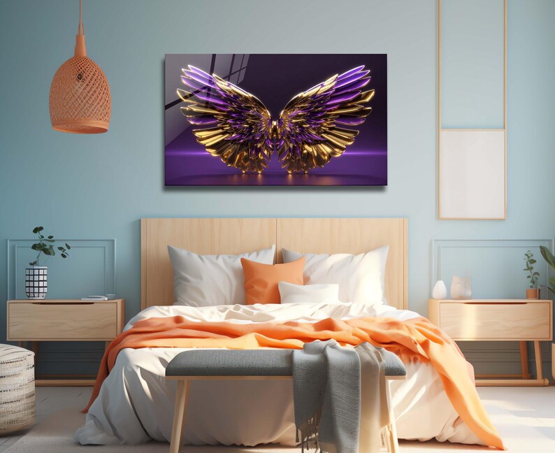 May include: A pair of gold and purple wings with a 3D effect, set against a purple background. The wings are spread wide and appear to be made of metal.