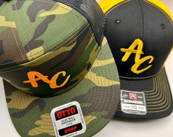 Boné Adam Church AC Logo – Designs camuflados e preto/dourado!
