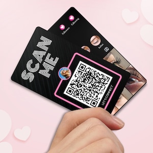 May include: Black and pink business card with a QR code and the text "SCAN ME" and "LET'S CONNECT". The card also features a small photo of a woman and a collage of images of eyelashes.