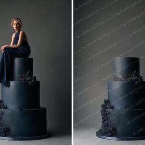 May include: A three-tiered navy blue cake with dark floral decorations. A person in a navy blue dress sits atop the cake. The cake is on a dark gray background. The cake is a centerpiece for a wedding or special event.
