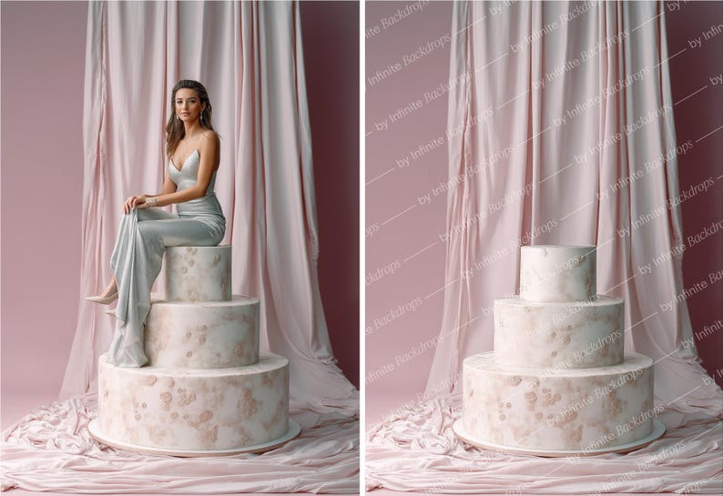 May include: A three-tiered cake with a marble-like design, featuring a light pink and beige color scheme. The cake is set against a backdrop of pink fabric and a woman in a silver dress is sitting on top of the cake.
