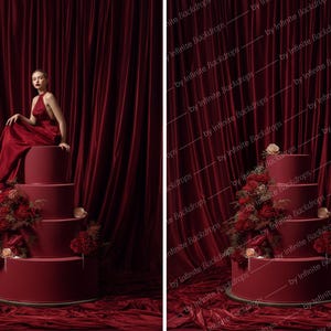 May include: A tiered, burgundy-colored cake with floral arrangements and a woman in a red dress. The cake is set against a backdrop of burgundy curtains and fabric, creating a dramatic and elegant scene.