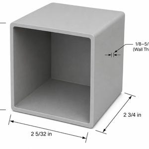 Puede incluir: Un tubo cuadrado abierto de color gris claro con una altura de 7,62 cm, un ancho de 5,48 cm, una profundidad de 6,99 cm y un grosor de pared entre 0,32 cm y 0,40 cm, indicado por las líneas de cota técnicas en el objeto.