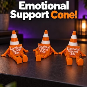 May include: Three orange and white traffic cone figures with articulated arms and legs, each holding a rectangular sign that reads Emotional Support Cone in white text. The figures are arranged in a row, featuring a bright orange base and cone top.