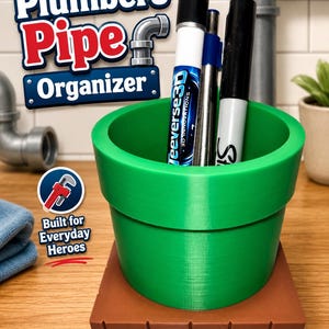 May include: A green cylindrical desk organizer shaped like a pipe, resting on a brown square base with a brick pattern. The organizer holds three markers. Text on the image reads Plumbers Pipe Organizer and Built for Everyday Heroes.