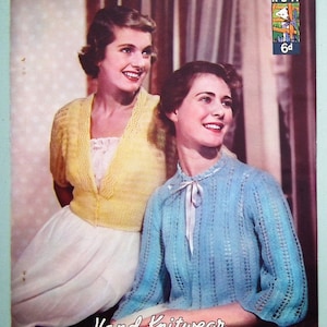 May include: Two women wearing knitted sweaters. The woman on the left is wearing a yellow sweater and a white skirt. The woman on the right is wearing a blue sweater with a white ribbon. The text "Hand Knitwear in Lavenda" is printed below the women. The text "N°341 6d" is printed in the upper right corner of the image.